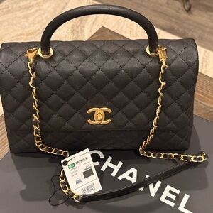 CHANEL Elegant Black Quilted Shoulder Bag with Gold Accents